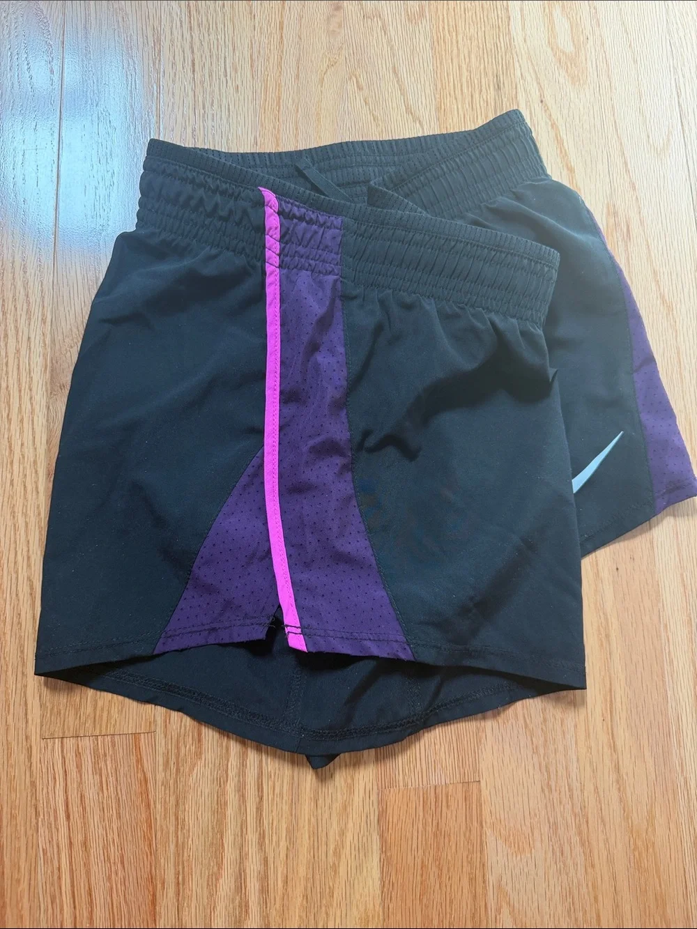Nike Women's Black Athletic Shorts with Purple Side Panels